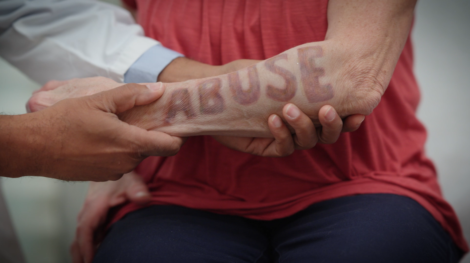 Man with his head in is hands in thought looking at his laptop computer screen.